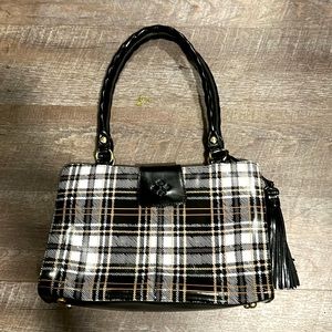 This is a Patricia Nash tote purse. Black and white plaid.